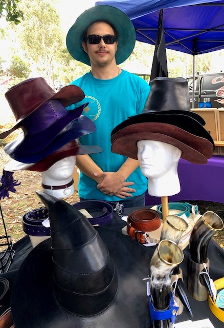 Guildford Medieval festival seller of hats, horns and other wares.