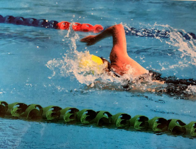 Picture of Colleen swimmer powering down the lanes of a swimming pool.